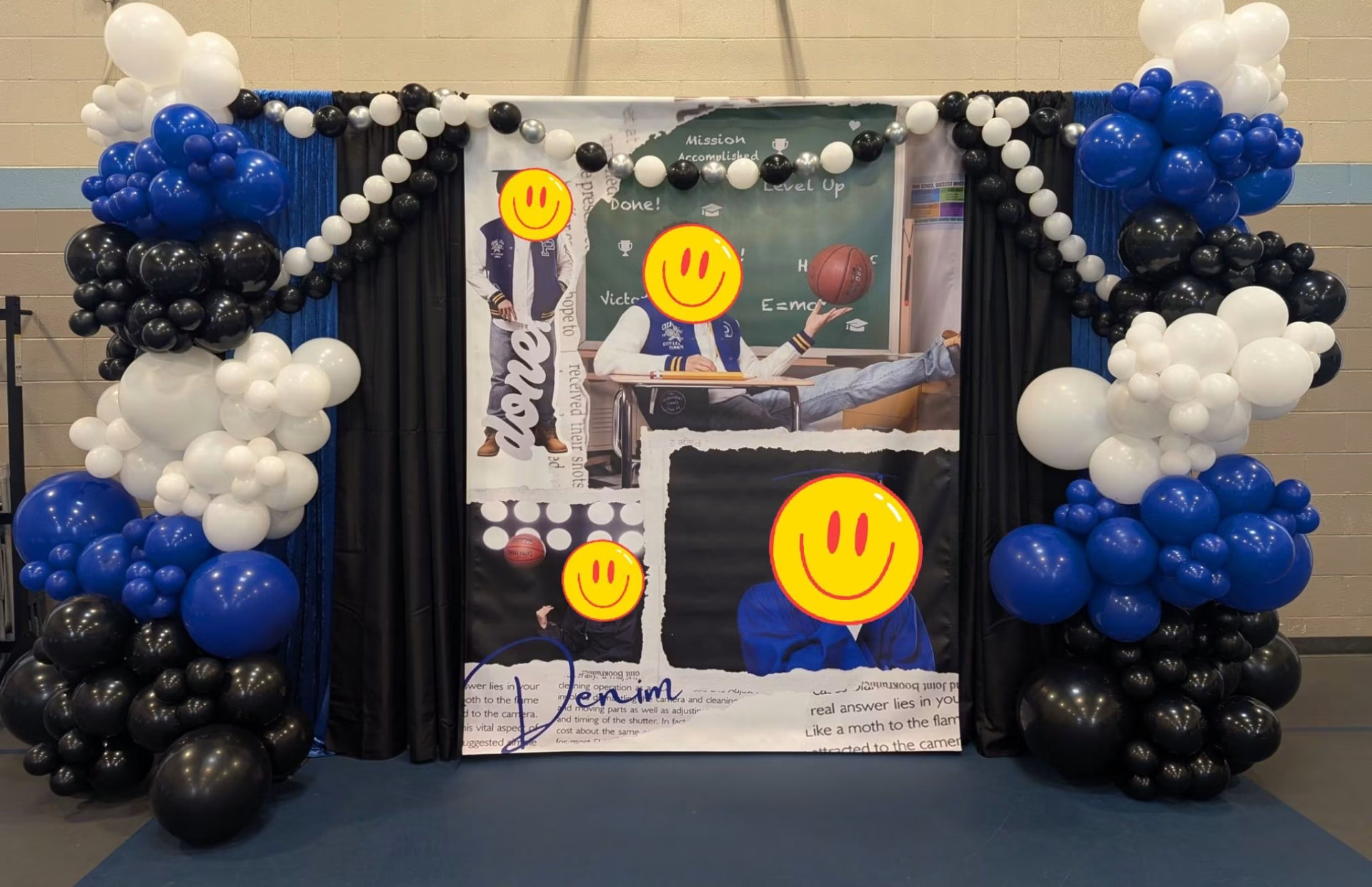 Blue, black and white graduation photo backdrop with balloon columns